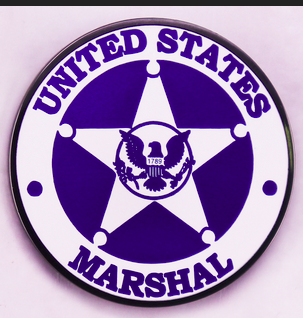 U.S. Marshals Service badge seal with star and eagle emblem representing federal law enforcement authority